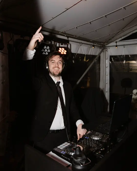 Mitchell Martin, Perth wedding DJ, mixing on the decks at a wedding reception