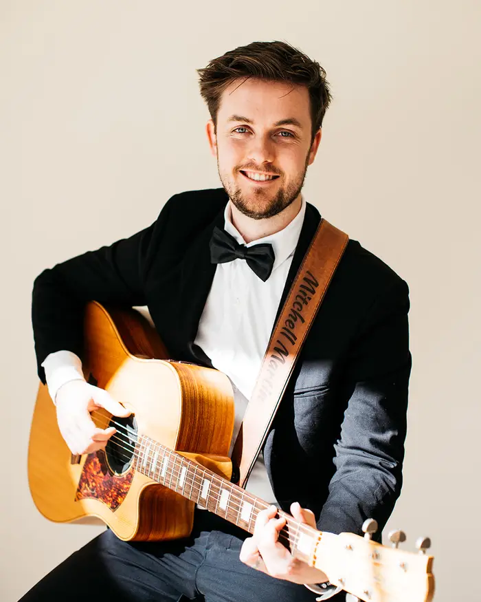 Mitchell Martin, Perth wedding musician, in black tie before a ceremony